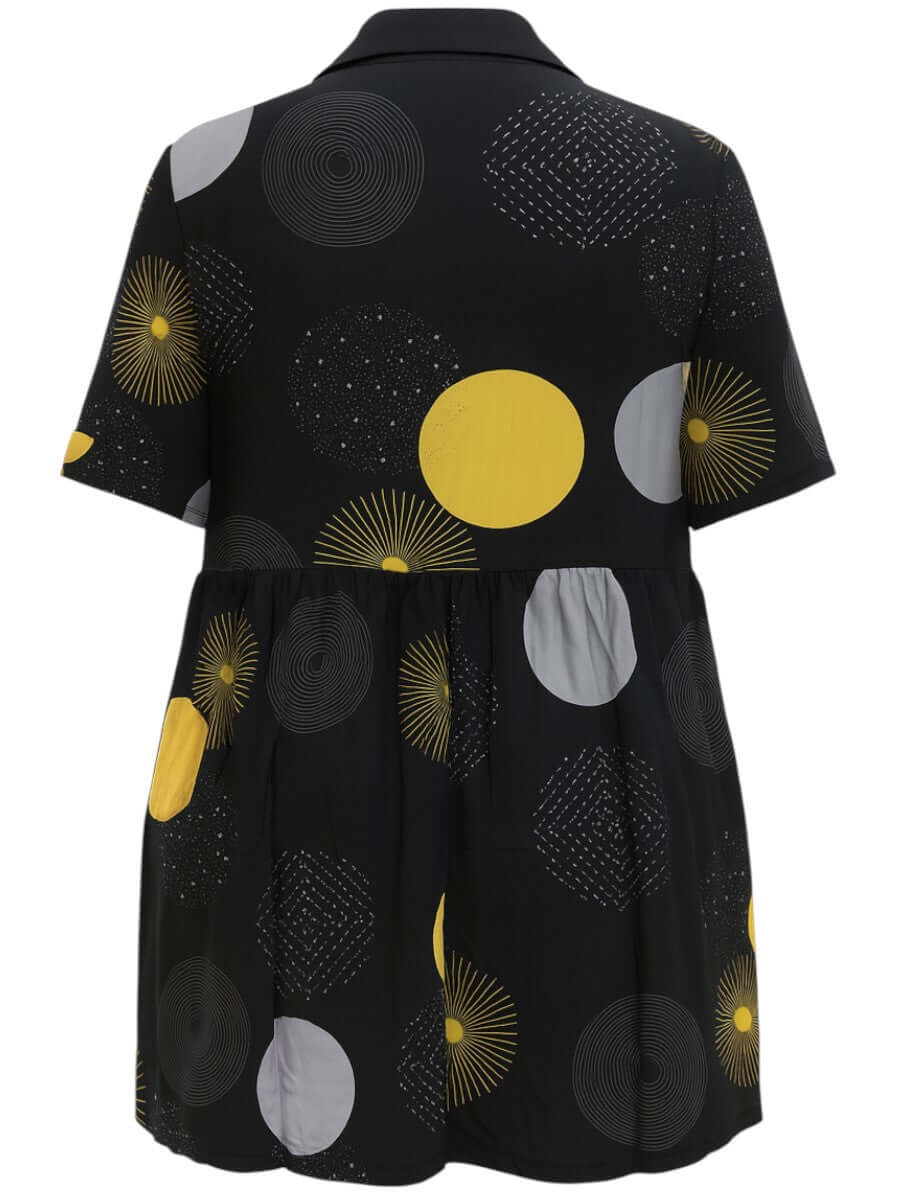 Coreen Tunic - Black Print featuring a stylish back view with a babydoll silhouette and playful circular patterns.
