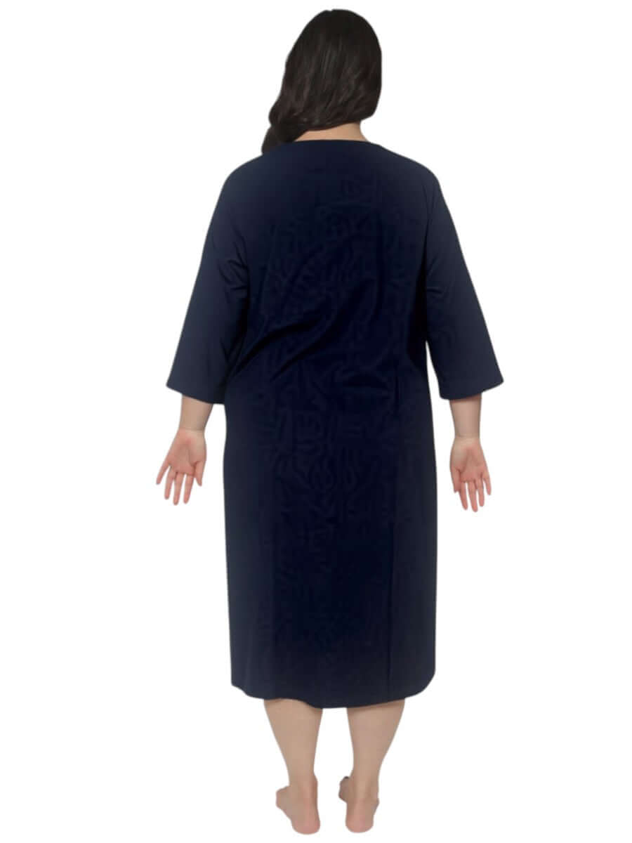 Back view of a woman wearing the Women’s Plus Dreams Nightie in Navy by Dale and Waters, showcasing its A-line design.