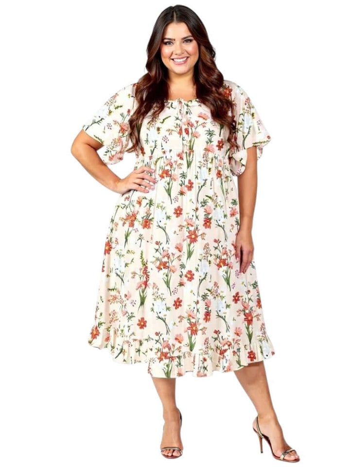 Dale and Waters Women’s Plus Size Trinity Dress in Apricot Print with floral design and pleated ruffles.