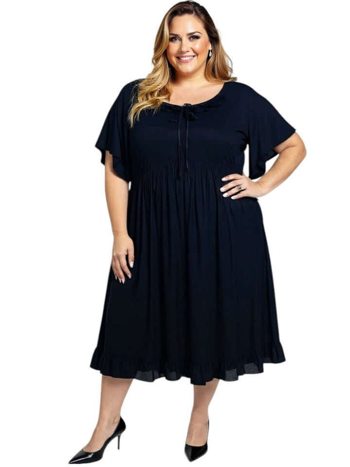 Women’s Plus Size Trinity Dress in Black by Dale and Waters featuring a pleated ruffle and relaxed fit for vintage charm.