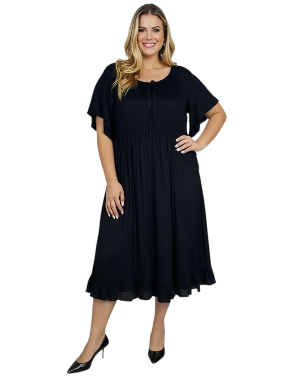 Women’s Plus Size Trinity Dress by Dale and Waters in elegant black, featuring short sleeves and a pleated ruffle neckline.
