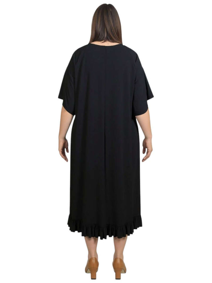 Back view of the Women’s Plus Size Trinity Dress in Black by Dale and Waters, featuring a ruffled hem and relaxed fit.