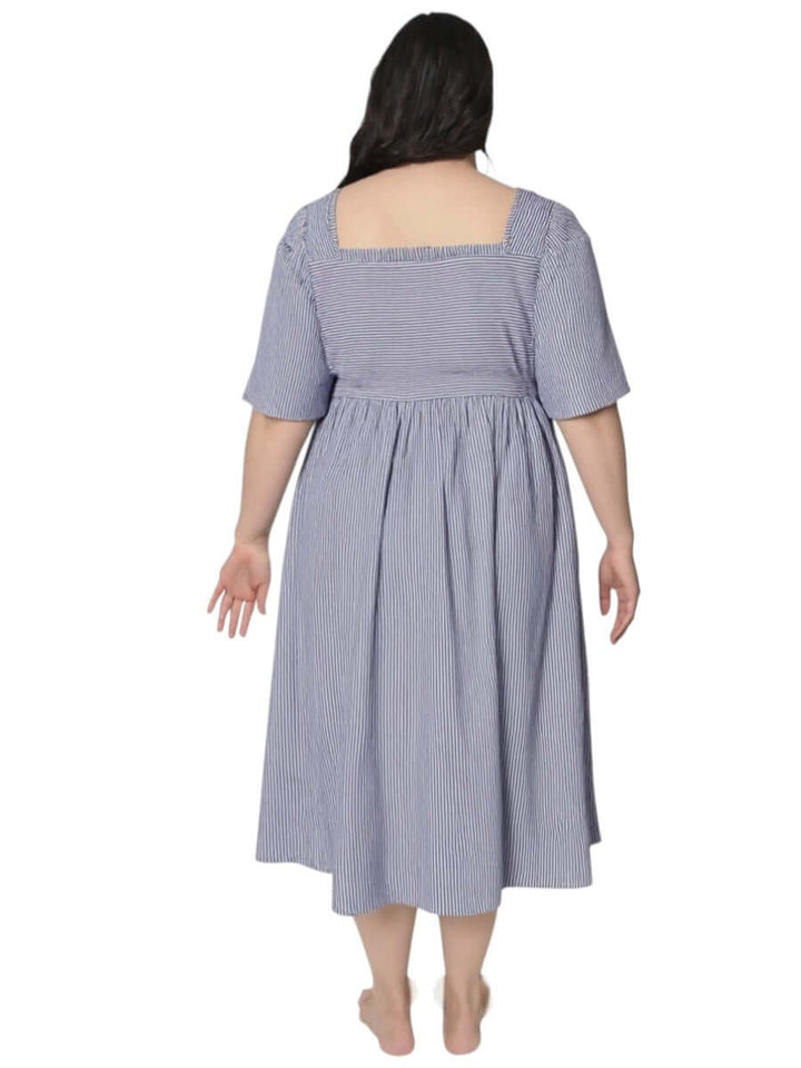 Back view of Women’s Plus Size August Dress – Blue Print by Dale and Waters, showcasing the square neckline and flowy fit.