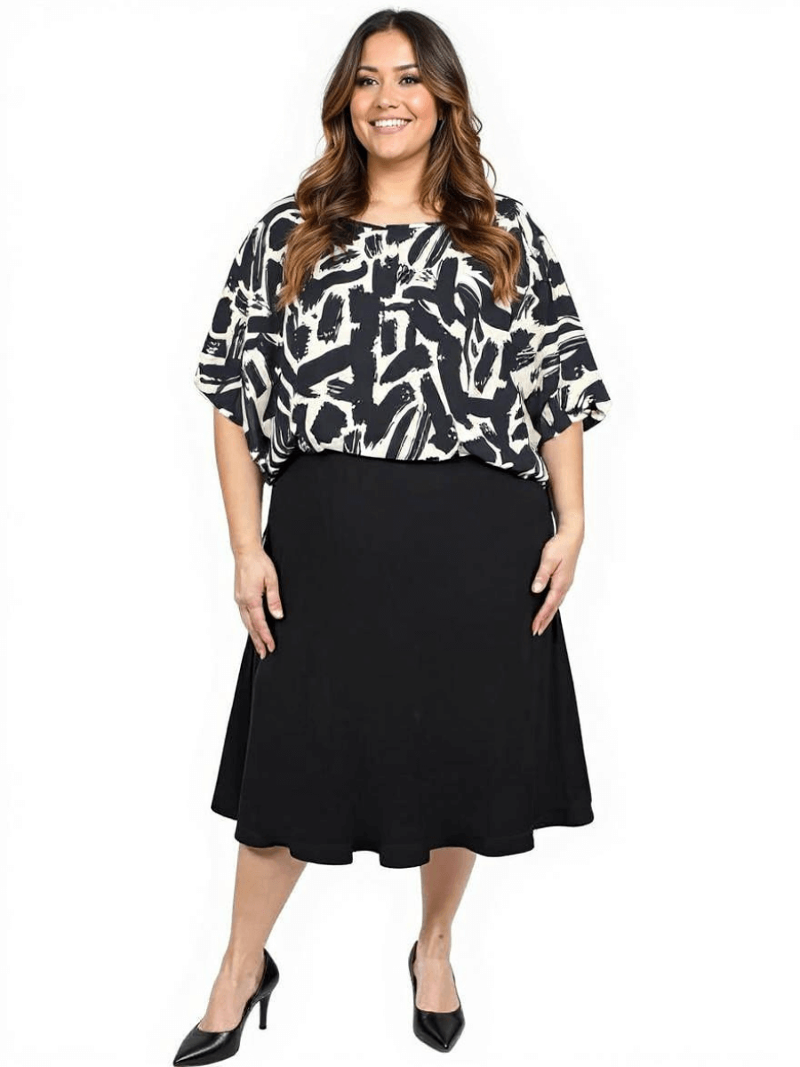 Women’s Plus Size Johanna Top in black and cream print styled with a black skirt for a chic look by Dale and Waters.