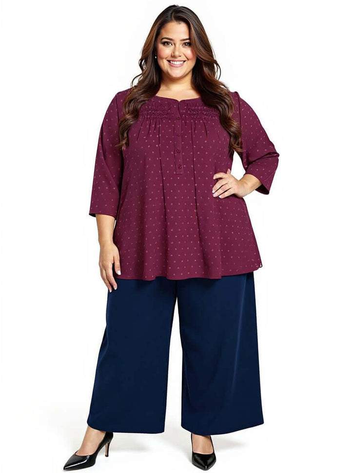 Stylish women's plus size Naya Top in wine color by Dale and Waters, featuring three-quarter sleeves and a relaxed fit.