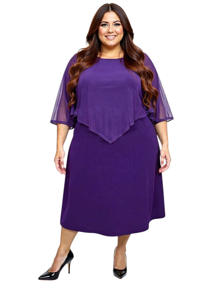 Plus size woman wearing a sophisticated deep purple mulberry silk dress with an elegant shawl-style cape collar from Dale and Waters