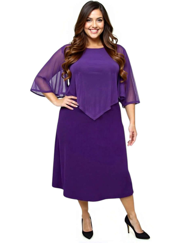 Elegant plus size women wearing a sleeveless mulberry silk dress with a shawl collar and open back.