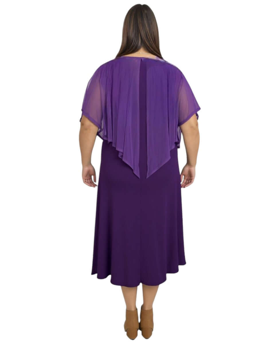 Back view of a plus size woman in a classic sleeveless mulberry silk dress with an elegant shawl collar.