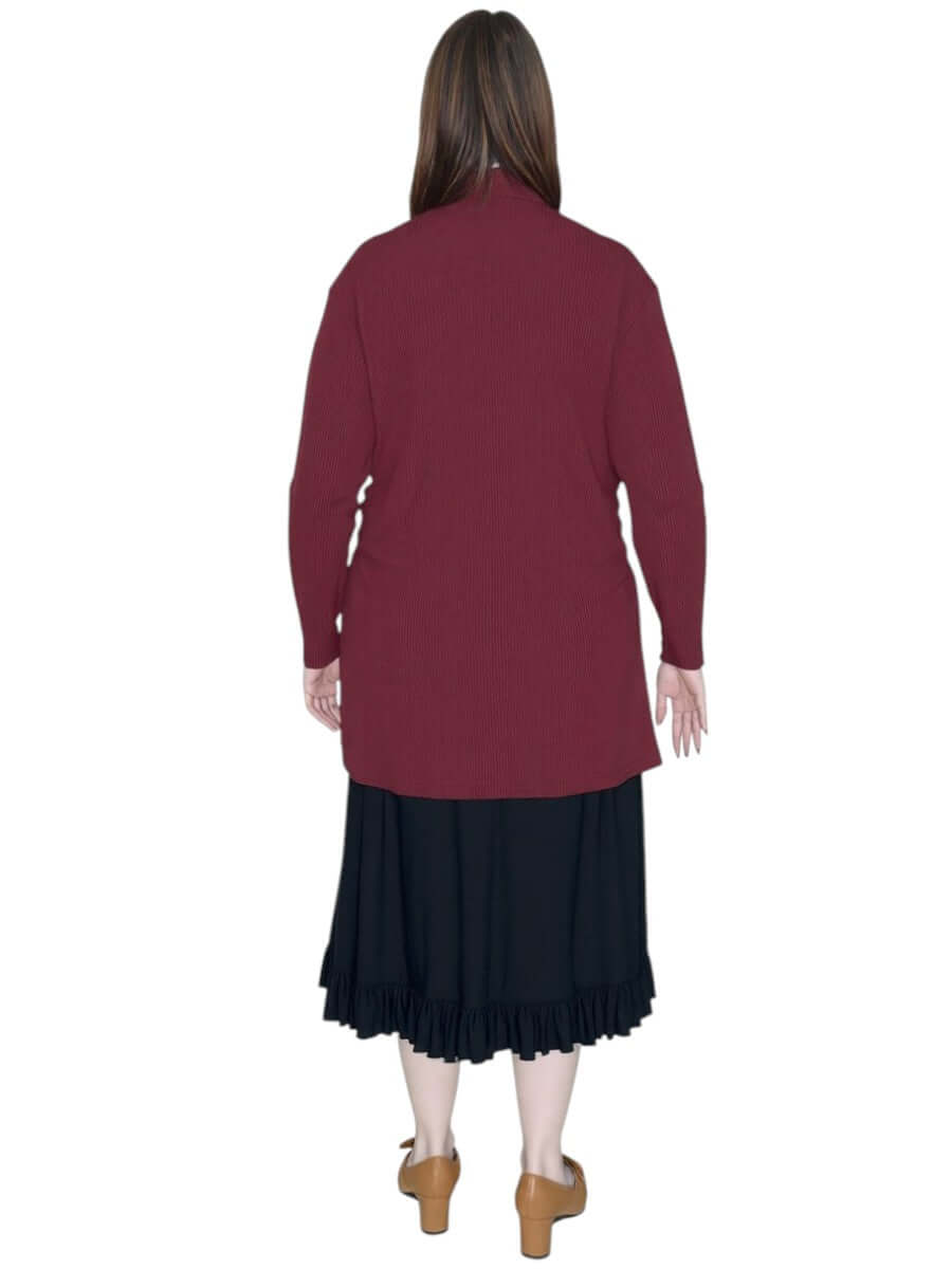 A lady wearing a plus-size edge-to-edge cardigan in wine, showcasing its lightweight and stretchy design from Dale and Waters.