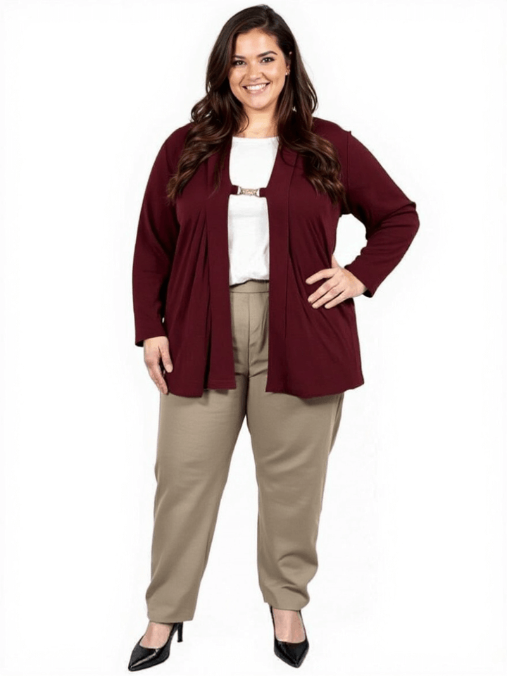 Plus size woman wearing a wine Mercedes E2E cardigan paired with beige trousers for a stylish layered look.