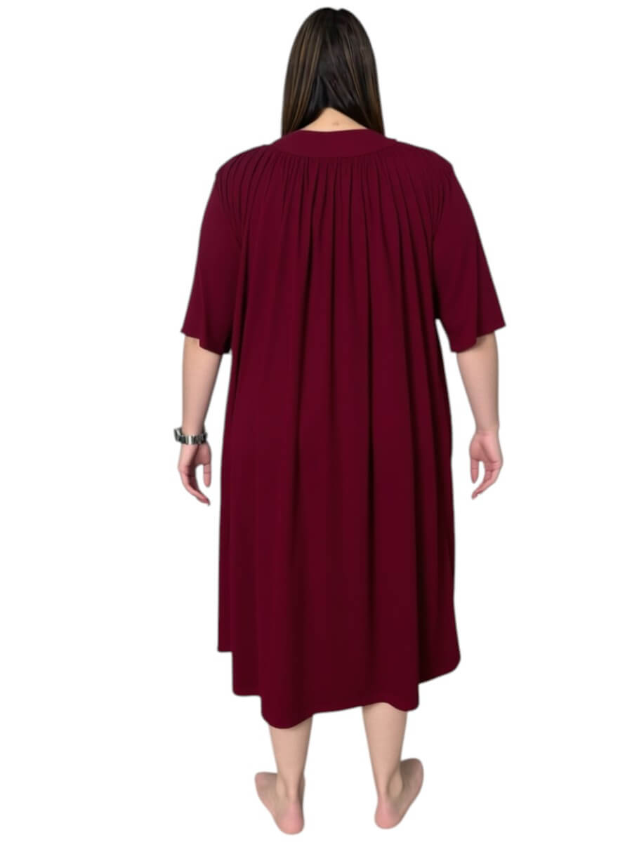 Back view of a women’s plus size spring dressing gown in wine color with soft pleats and ¾ sleeves by Dale and Waters.