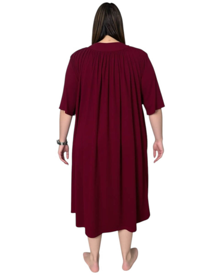 Back view of a women’s plus size spring dressing gown in wine color with soft pleats and ¾ sleeves by Dale and Waters.