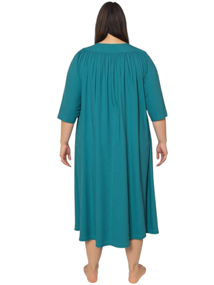 Back view of women’s plus size teal spring dressing gown from Dale and Waters, featuring soft pleats and ¾ sleeves.