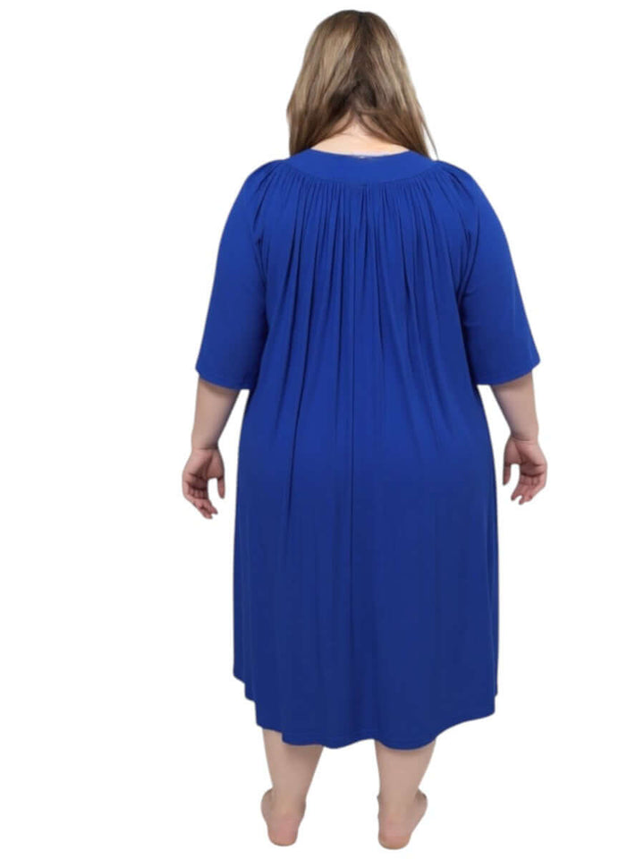 Back view of a women's plus size navy spring dressing gown by Dale and Waters, featuring soft pleats and ¾ sleeves.
