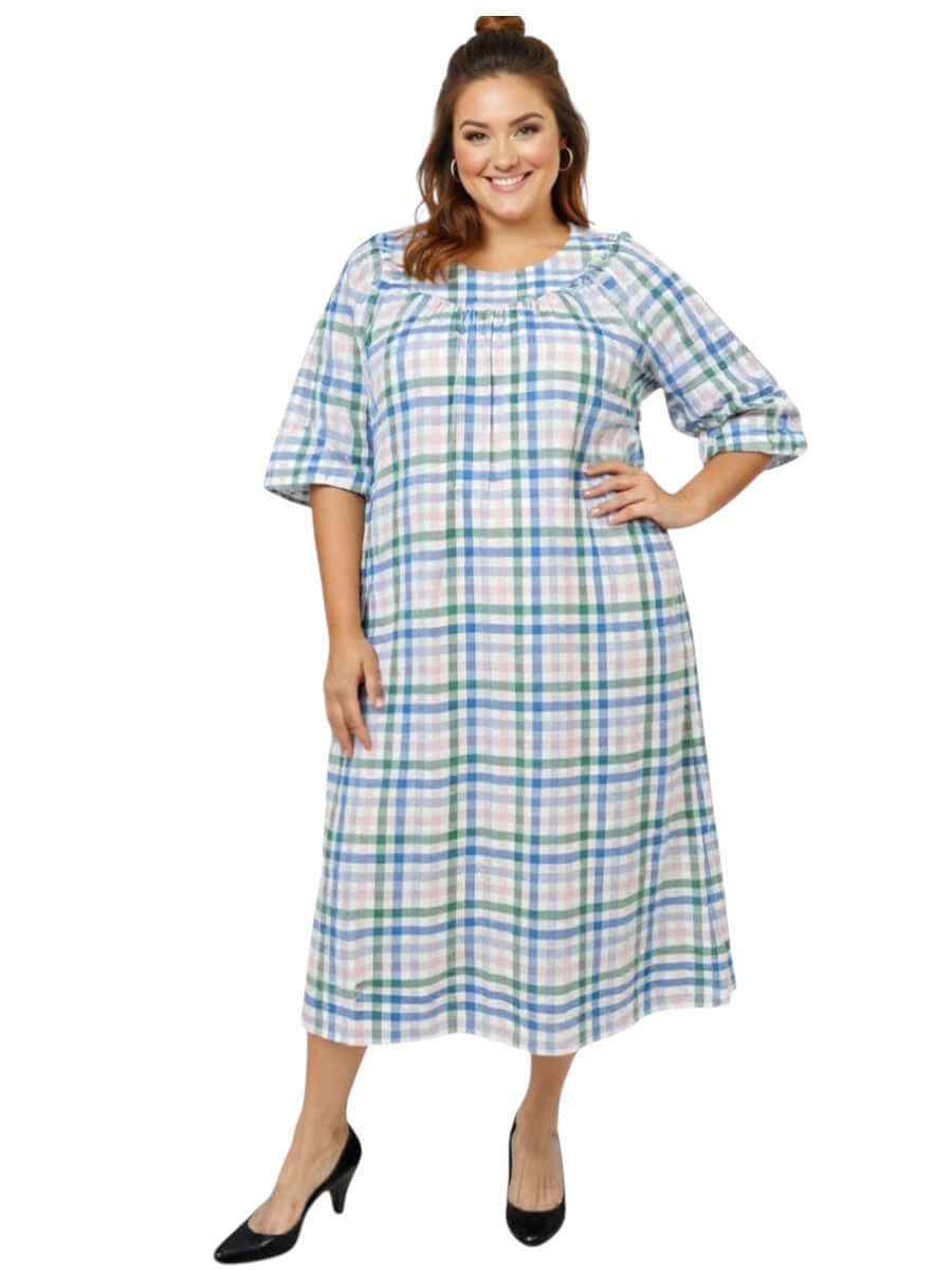 Plus size model wearing the Parish Seersucker Dress - Blue Print, a stylish cotton dress for warm summer days.