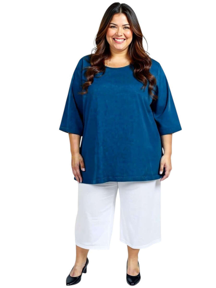 Woman in navy top and white Love Is In The Air Pants - White, plus size fashion from Dale & Waters for sizes 16-50.