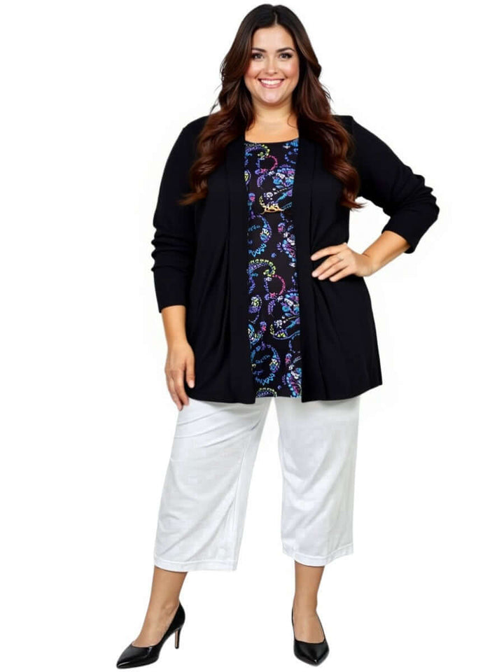 Woman wearing Love Is In The Air Pants - White with a black cardigan, showcasing plus size fashion for sizes 16-50.