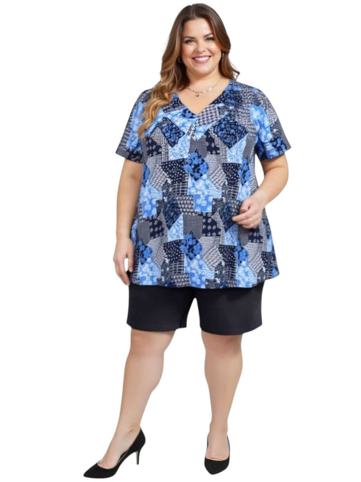 Women’s plus size model wearing Denim Shorts - Black with a colorful top, showcasing comfortable summer style.