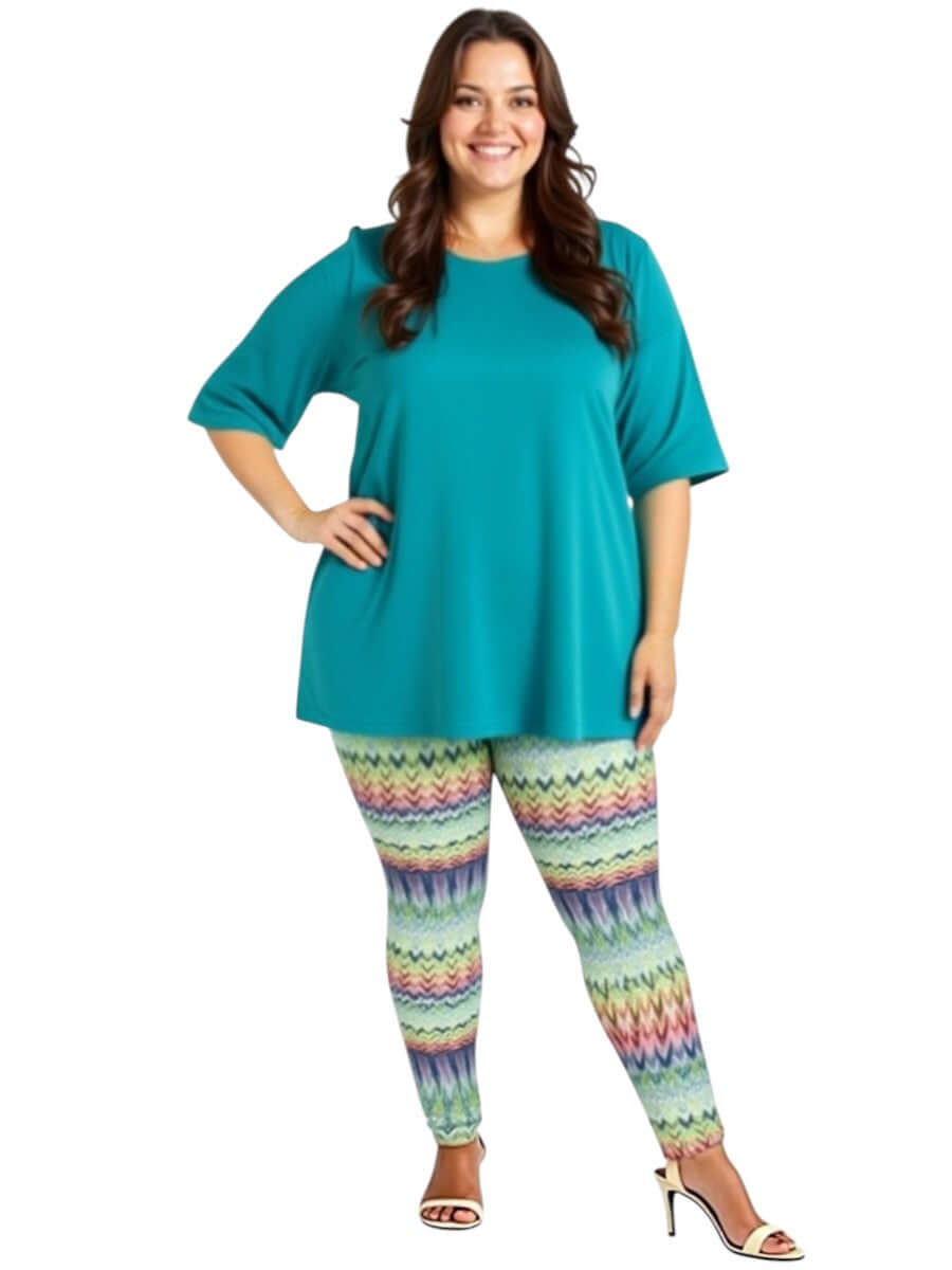 Plus size woman wearing Atlas Leggings - Multi Print with a teal top, showcasing comfort and style.