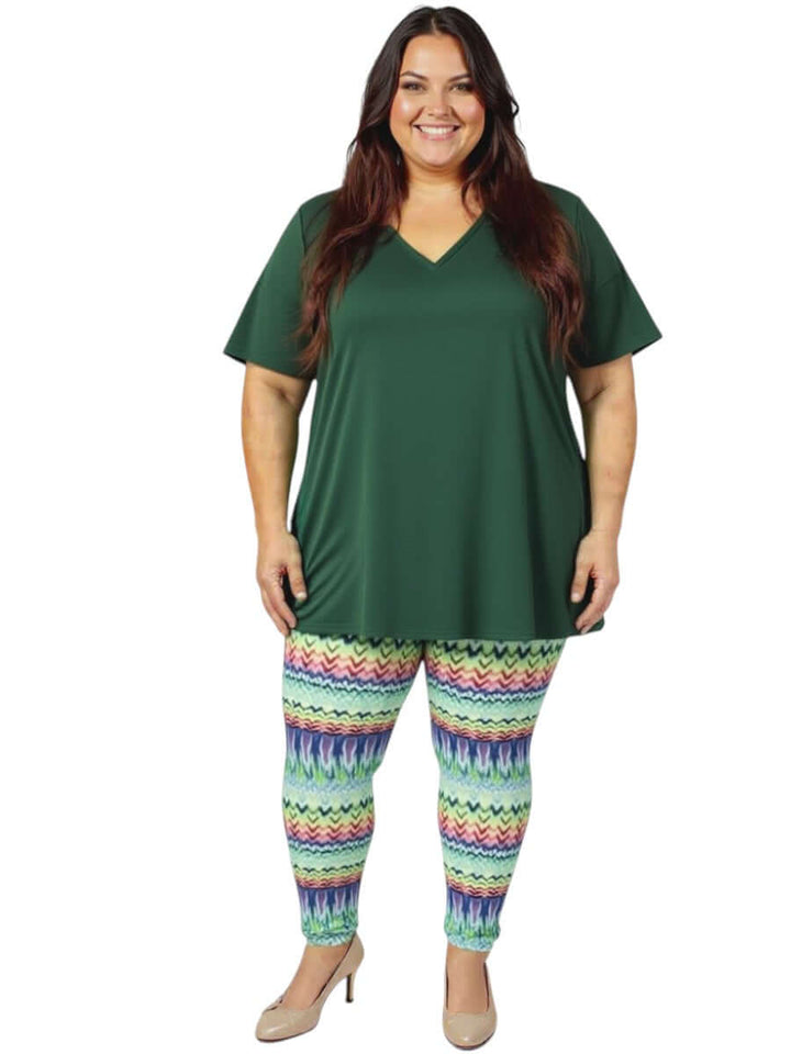 Women model wearing Atlas Leggings - Multi Print with a green top, showcasing plus size fashion for sizes 16-50.