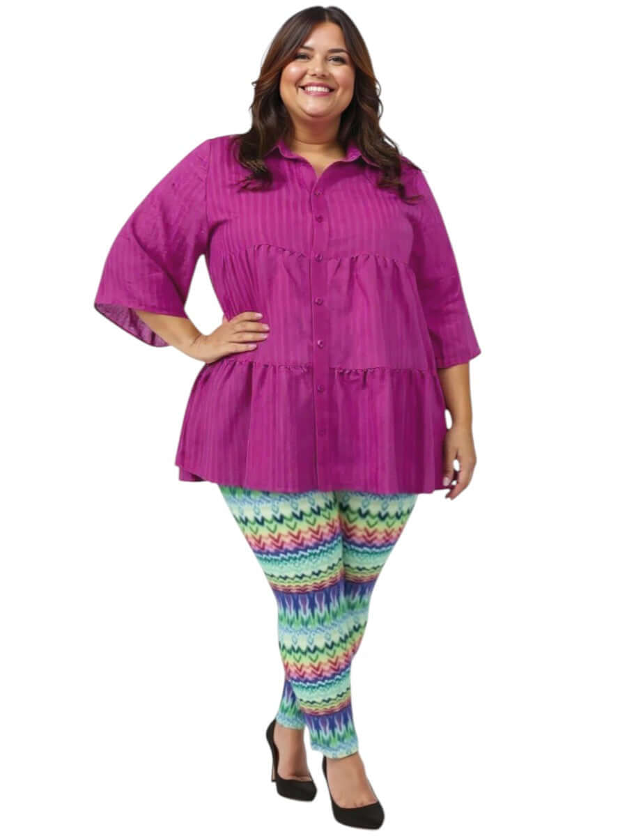 Plus size woman wearing Atlas Leggings - Multi Print and a purple top, showcasing comfortable, stylish attire.