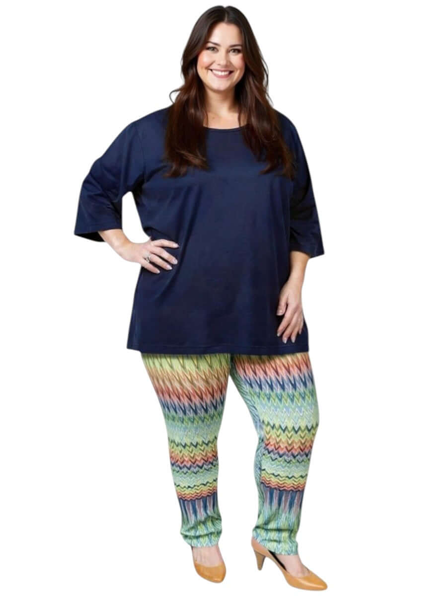 Women’s plus size model in Atlas Leggings - Multi Print, comfortable elastic waistband and stylish design.