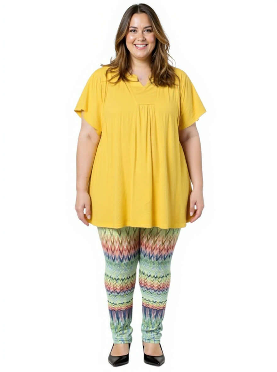 Woman wearing Atlas Leggings - Multi Print paired with a yellow top, showcasing plus size fashion from Dale & Waters.