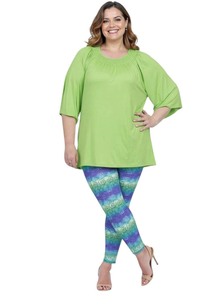 Women wearing Atlas Leggings - Purple Print with light green top, showcasing plus size style and comfort.