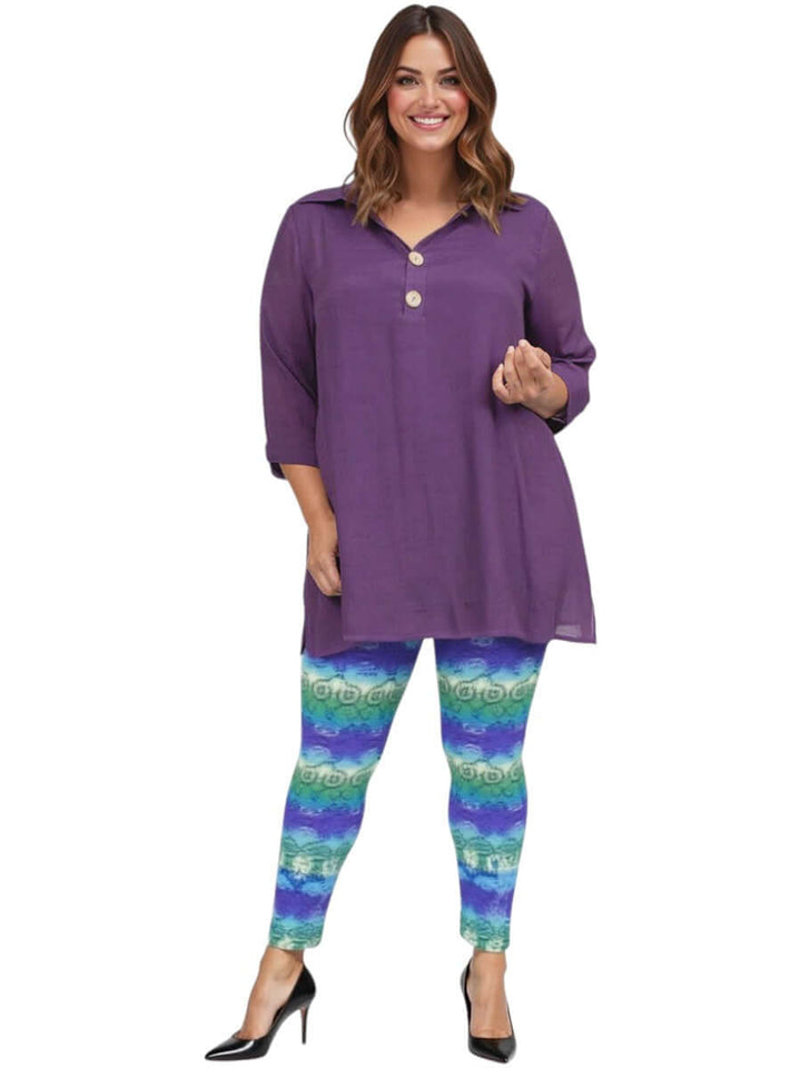 Woman wearing Atlas Leggings - Purple Print with a purple tunic, showcasing plus size fashion.