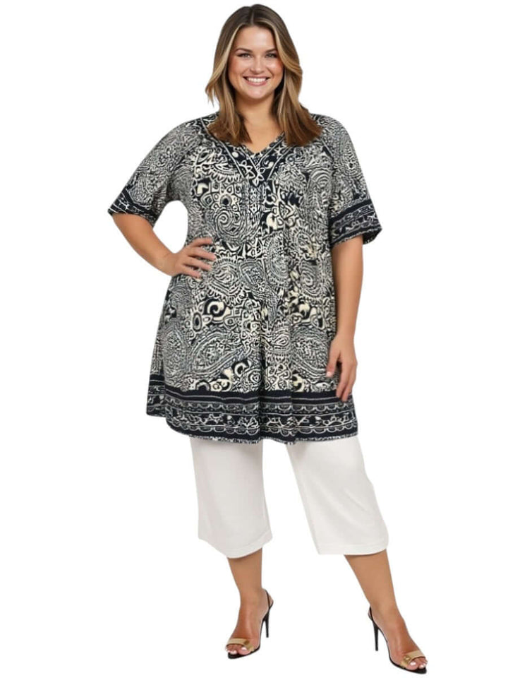 Plus size woman modeling Love Is In The Air Pants - White with a stylish patterned top, perfect summer outfit.
