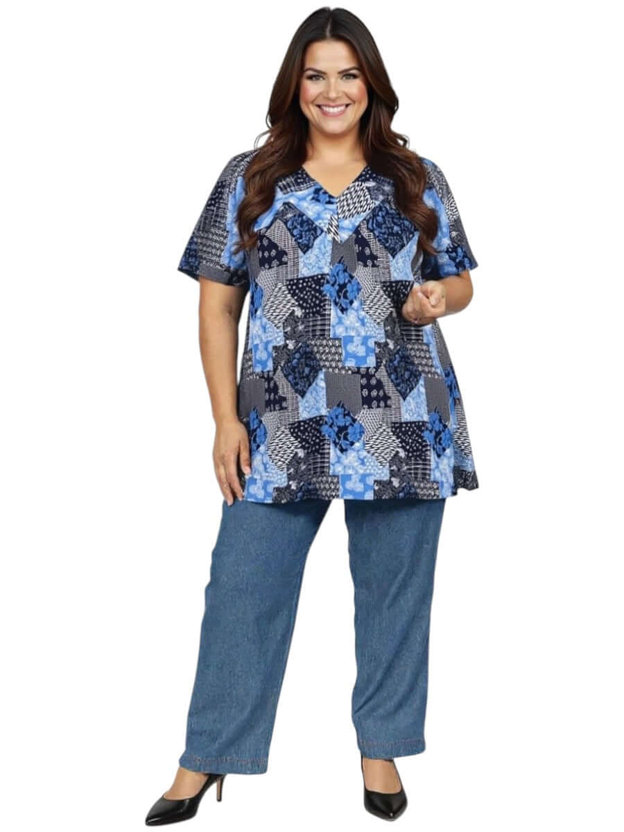 Women in plus size Sterling Fields Top - Patchwork Print featuring a V-neckline and comfortable fit in a patchwork design.