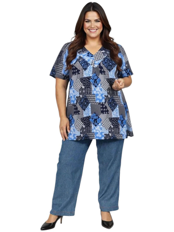 Women in plus size Sterling Fields Top - Patchwork Print featuring a V-neckline and comfortable fit in a patchwork design.