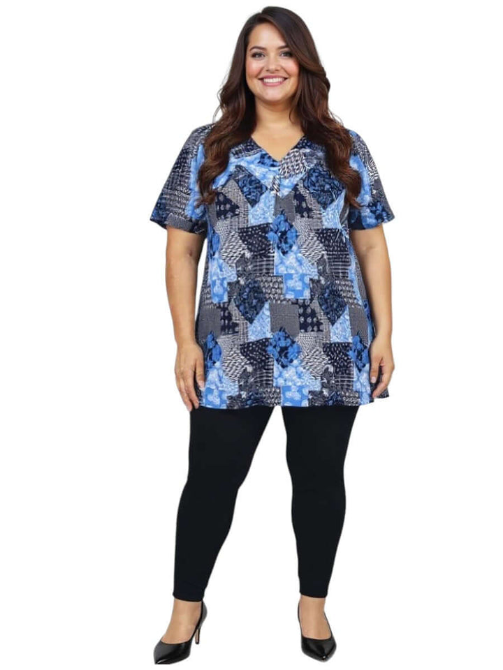 Plus size Sterling Fields Top - Patchwork Print worn by a curvy woman, showcasing a stylish V-neck and breathable fabric.