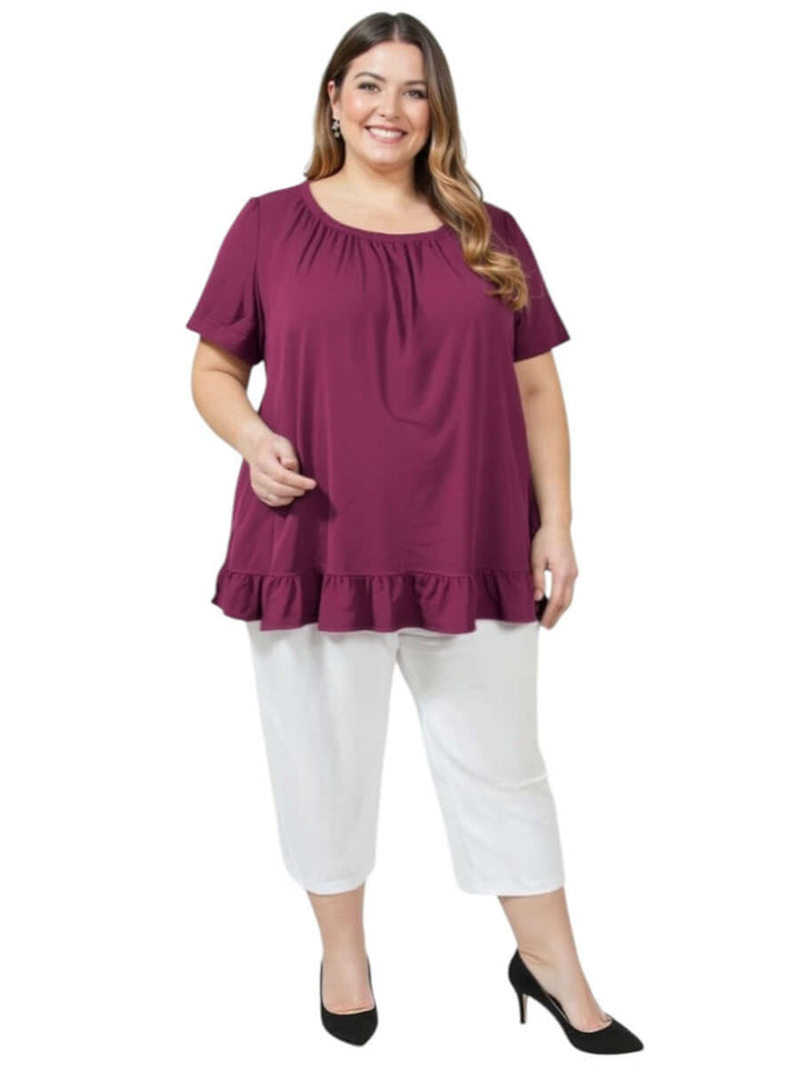 Plus size women modeling Love Is In The Air Pants - White paired with a stylish purple top for summer elegance.