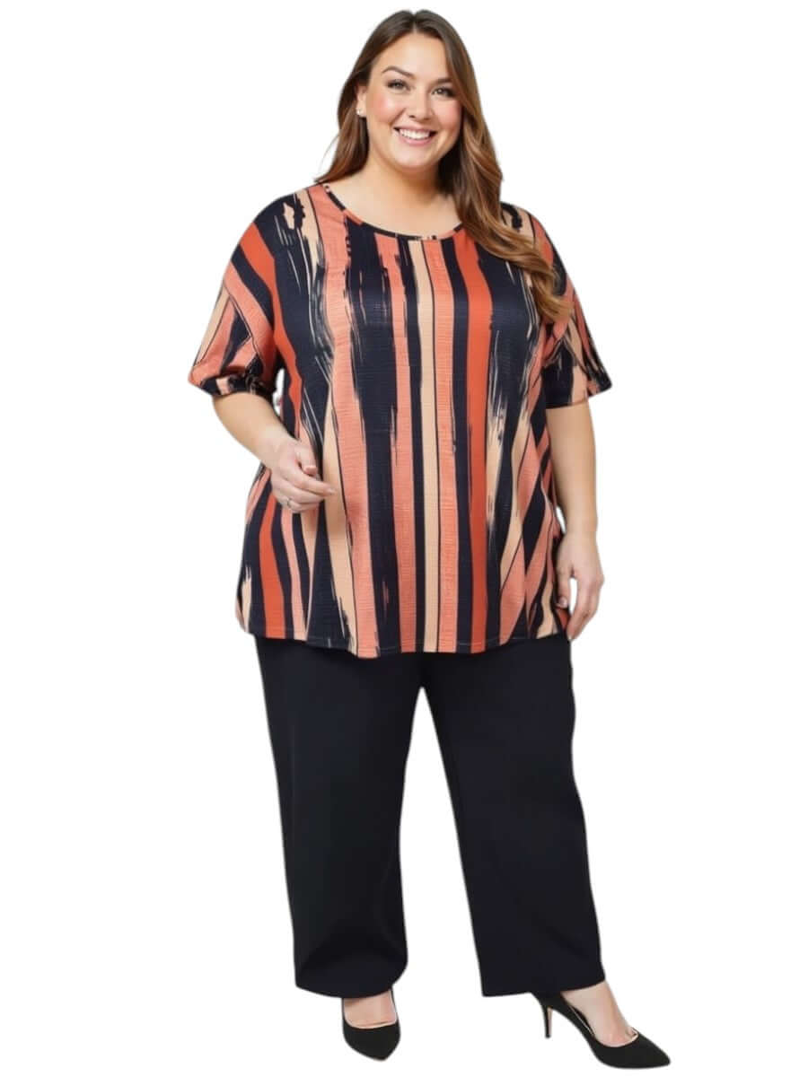 Women’s Plus Size Velma Top - Multi print worn with black pants, showcasing a stylish and comfortable design with vertical stripes.