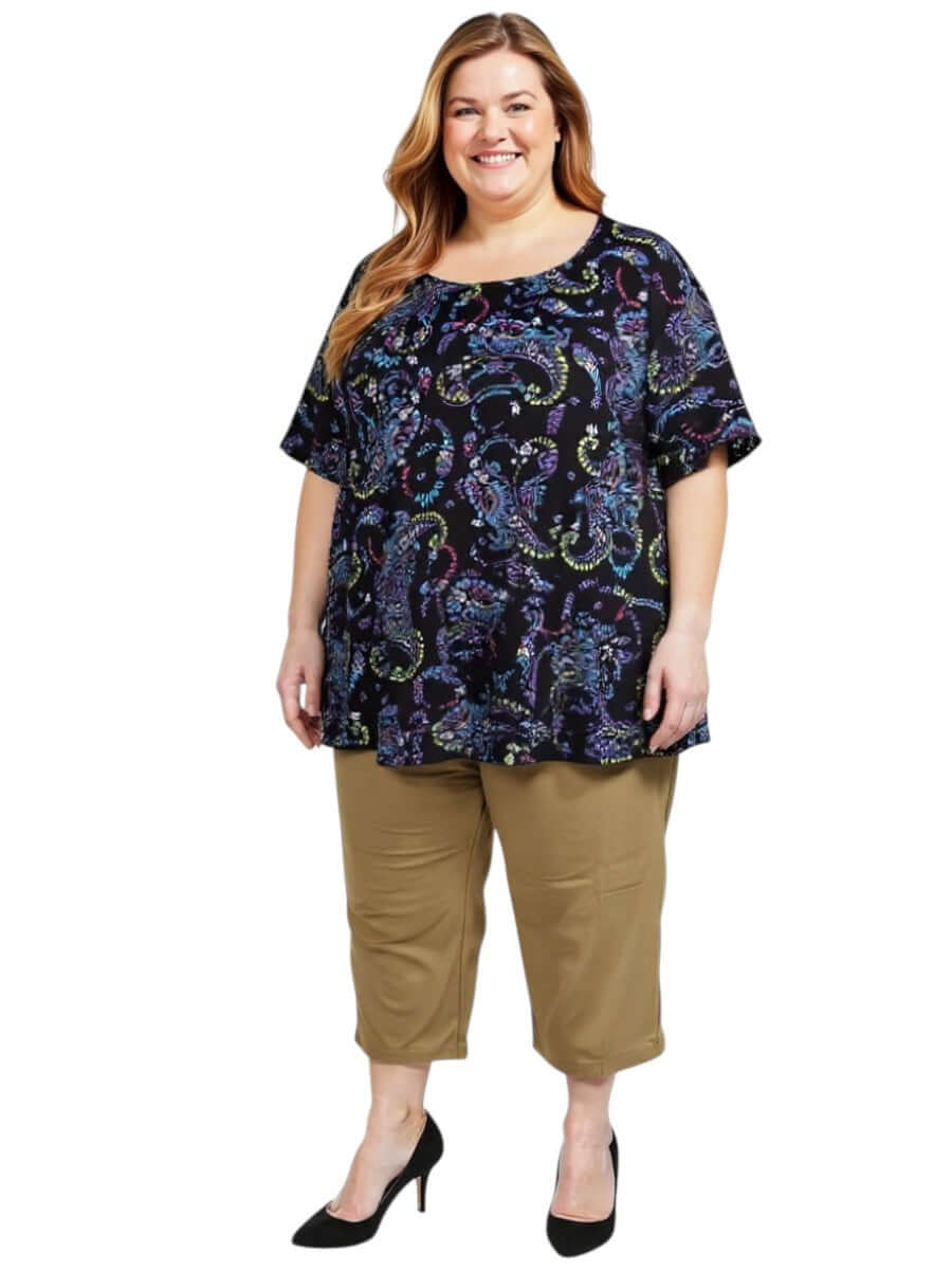 Estela Top - Black Print worn by a plus-size woman, showcasing flattering fit and lightweight, easy-wear style.