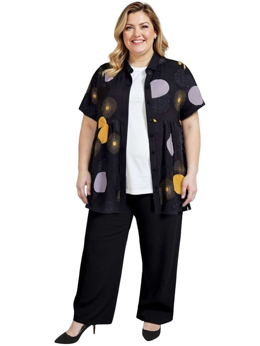 Coreen Tunic - Black Print worn with black pants, designed for plus-size women for stylish comfort.