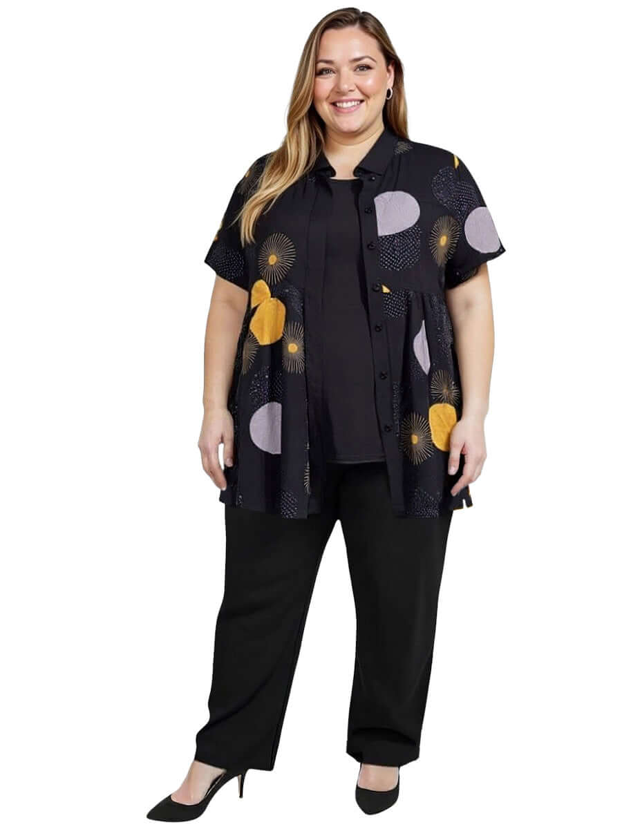 Coreen Tunic - Black Print on a plus-size model, showcasing a stylish babydoll blouse for curvy women.