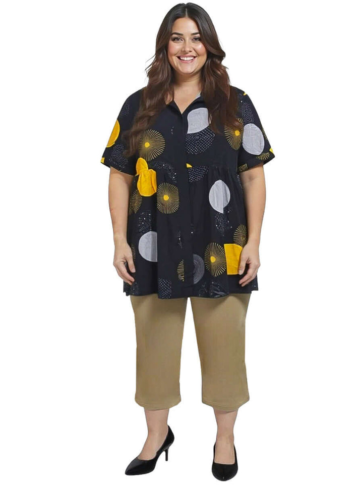 Coreen Tunic - Black Print featuring a plus-size model with a relaxed babydoll fit and stylish print, perfect for everyday wear.