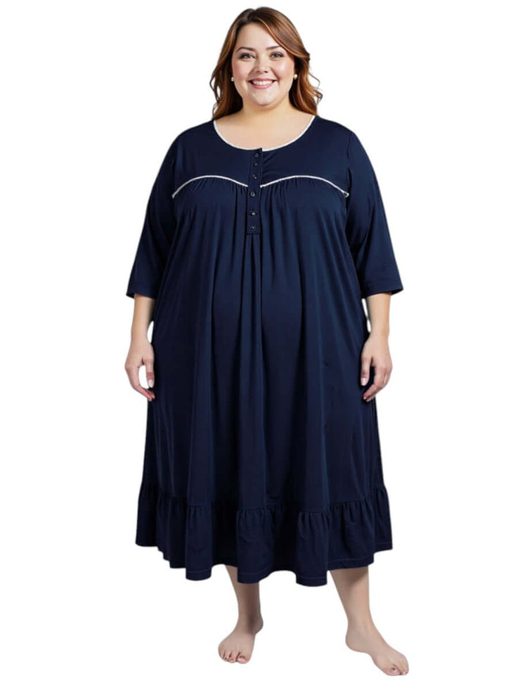 Plus size model wearing the Paxton Nightie - Navy with 3/4 sleeves and frill hem, showcasing comfort and elegance.