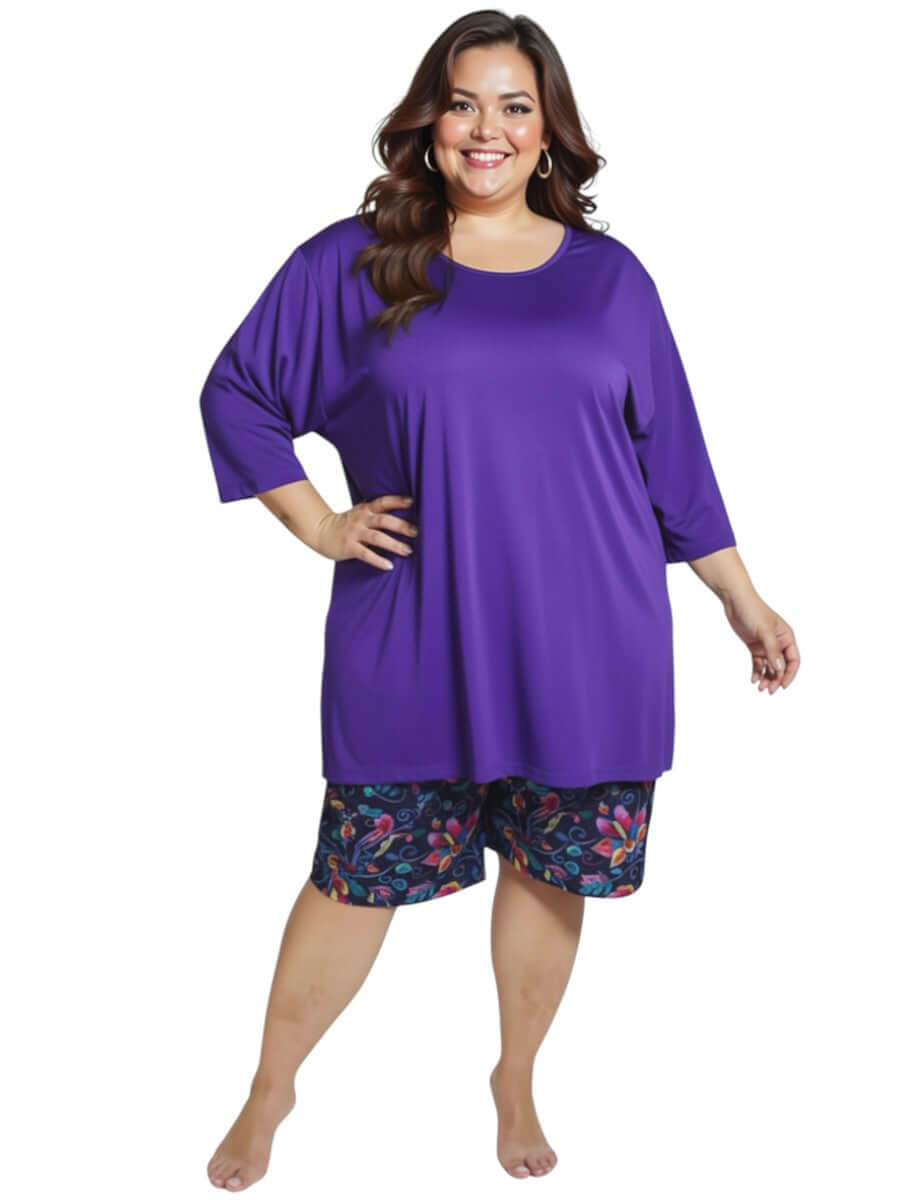 Plus size model wearing Midnight Plum Swim Rashi - Purple by Dale and Waters, size 16-50, showcasing comfort and style.