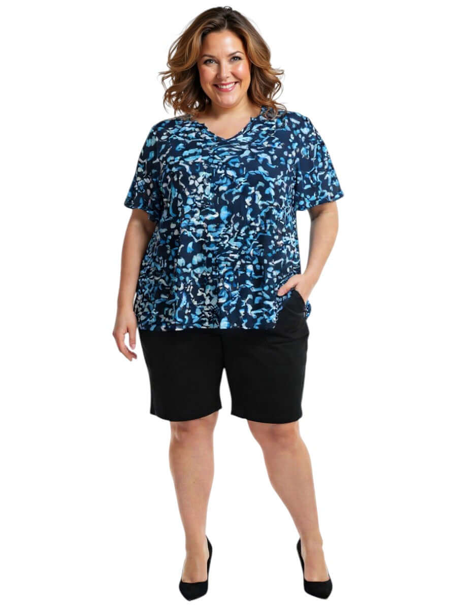 Women in plus size Ocean Top - Blue Print by Dale and Waters, featuring a vibrant abstract design and comfortable fit.