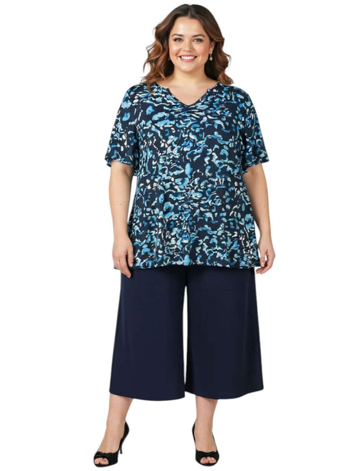 Women's Plus Size Ocean Top - Blue Print by Dale and Waters in vibrant blues paired with navy culottes.