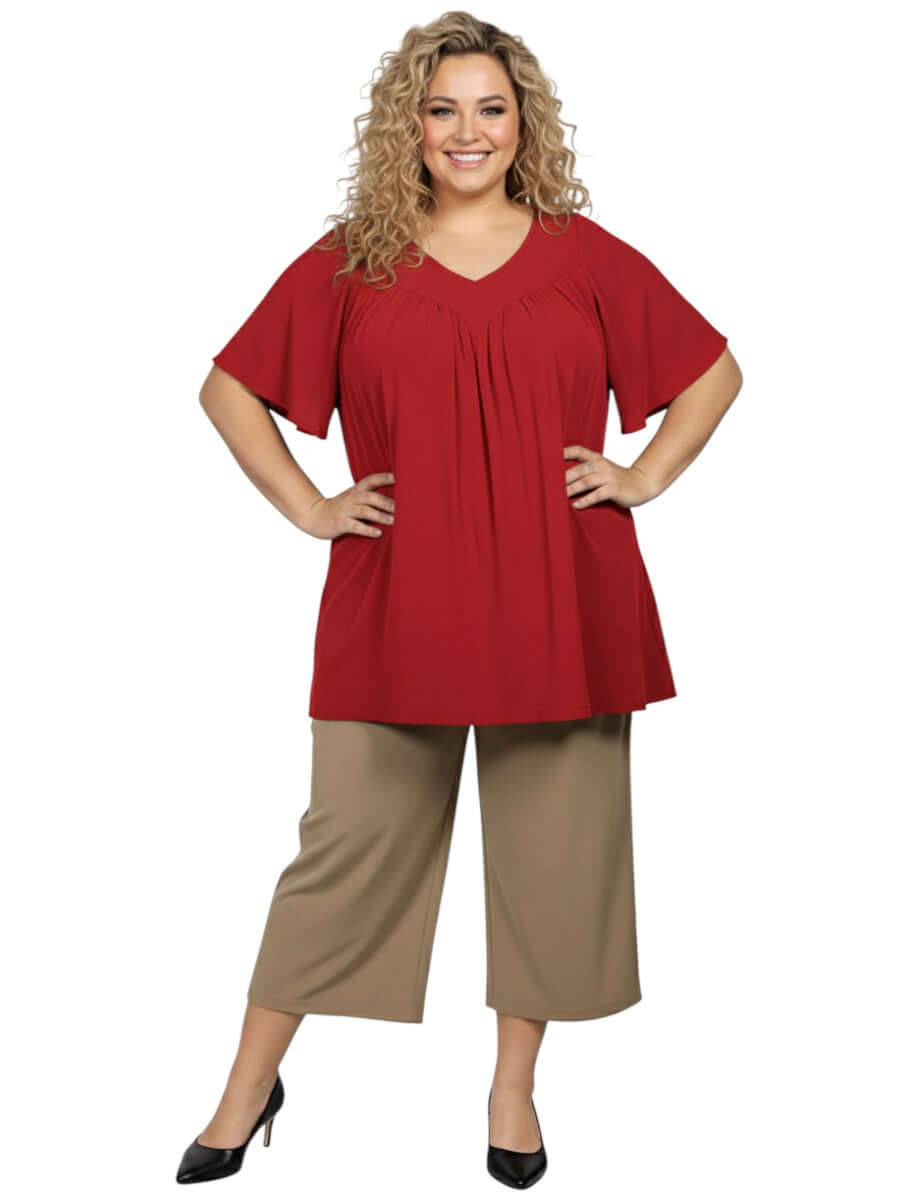 Leeman Top - Red worn by a plus size woman, showcasing elegant drape and flattering design, from Dale and Waters, sizes 16-50.