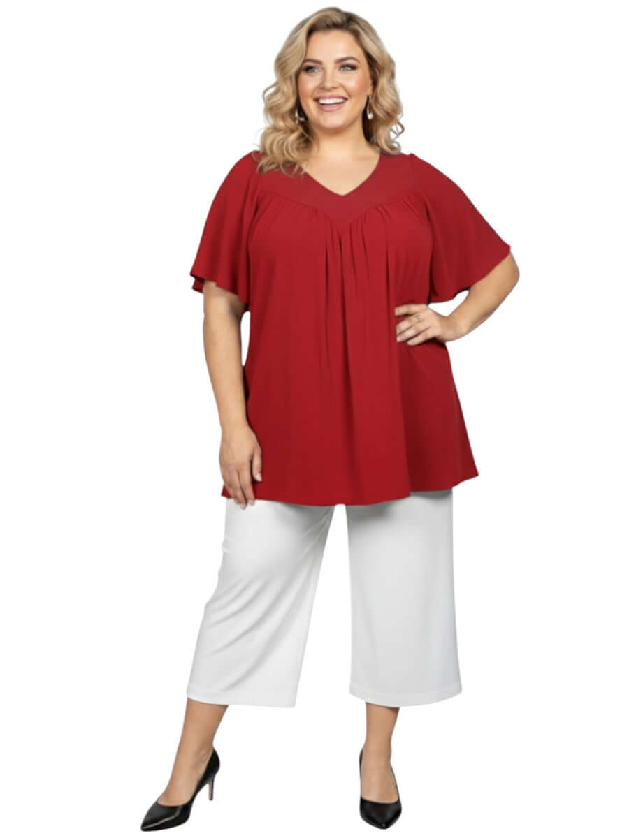 Women wearing Leeman Top - Red by Dale and Waters, size 16-50, showcasing elegant drape and flattering design.