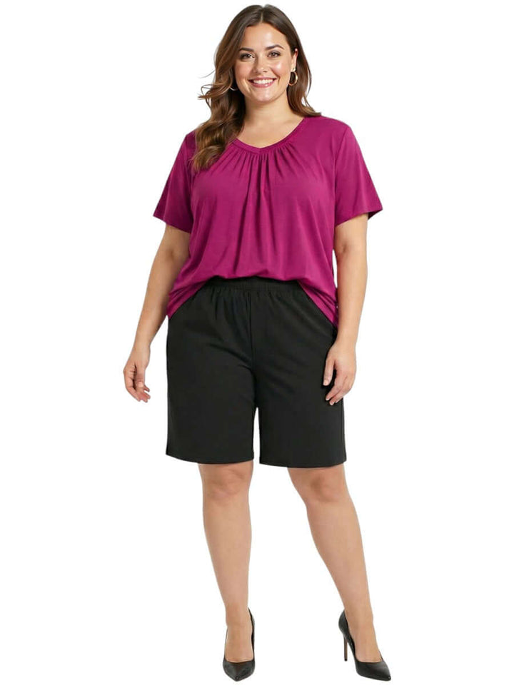 Women wearing Montez Top - Pink with stylish shorts, showcasing fashionable plus size women's clothing.