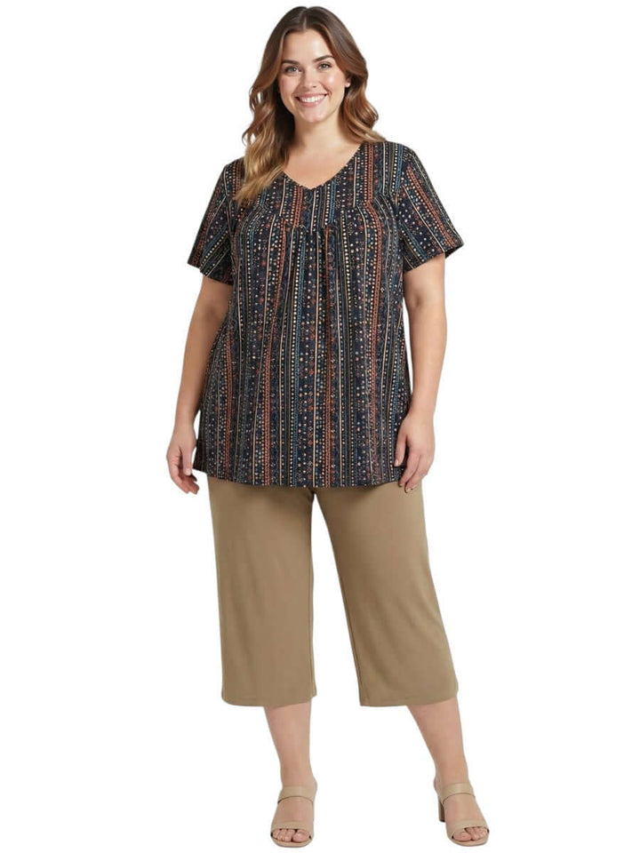 Women wearing Fernando Top - Black Print, featuring geometric stripes in earthy tones, plus size fashion.