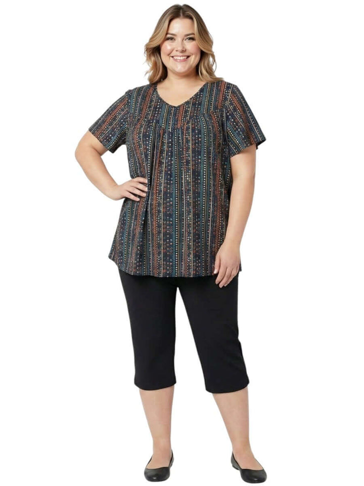 Women fashion plus size Fernando Top - Black Print, featuring vibrant geometric patterns in earthy tones.