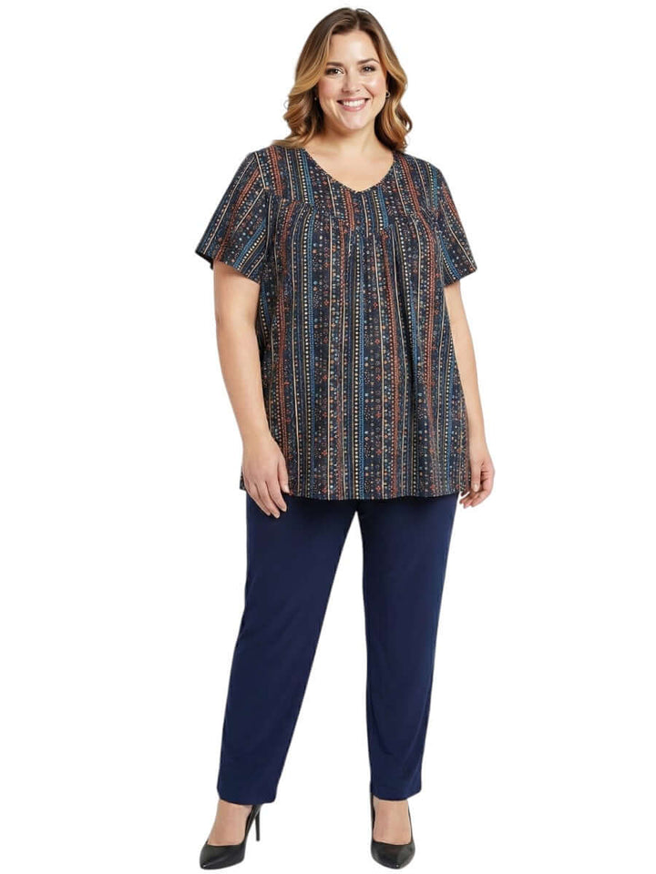 Women's Plus Size Fernando Top - Black Print featuring geometric patterns and vibrant colors in a stylish design.
