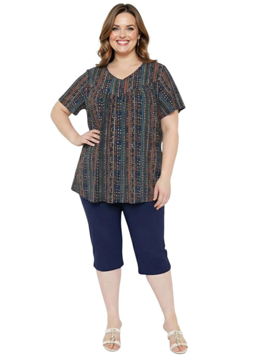 Women’s Plus Size Fernando Top - Black Print featuring vibrant geometric patterns and comfortable fit.